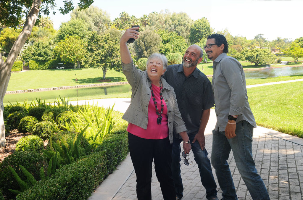 Group of friends in a park taking a selfie