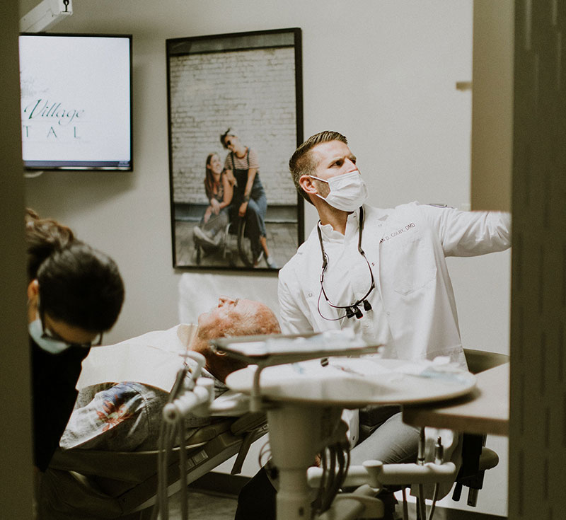 Dr. Colby, dentist in Oceanside, with patient at Oceanview Dental
